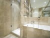 Elegant bathroom remodel with marble shower walls and floor